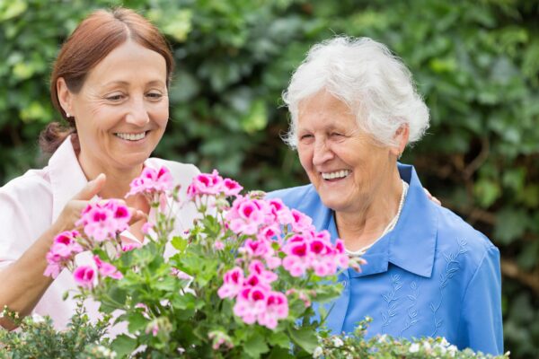 Gardening - senior woman with flowers